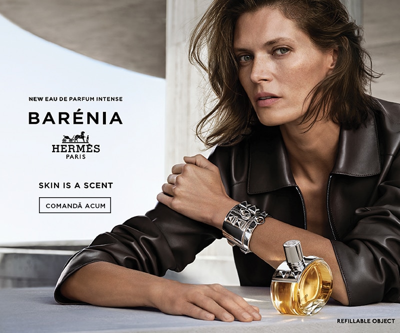 Parfum Hermès Barénia Eau de Parfum Intense, prezentat alături de flaconul elegant aurit și accesorii metalice, în cadrul unei campanii premium.